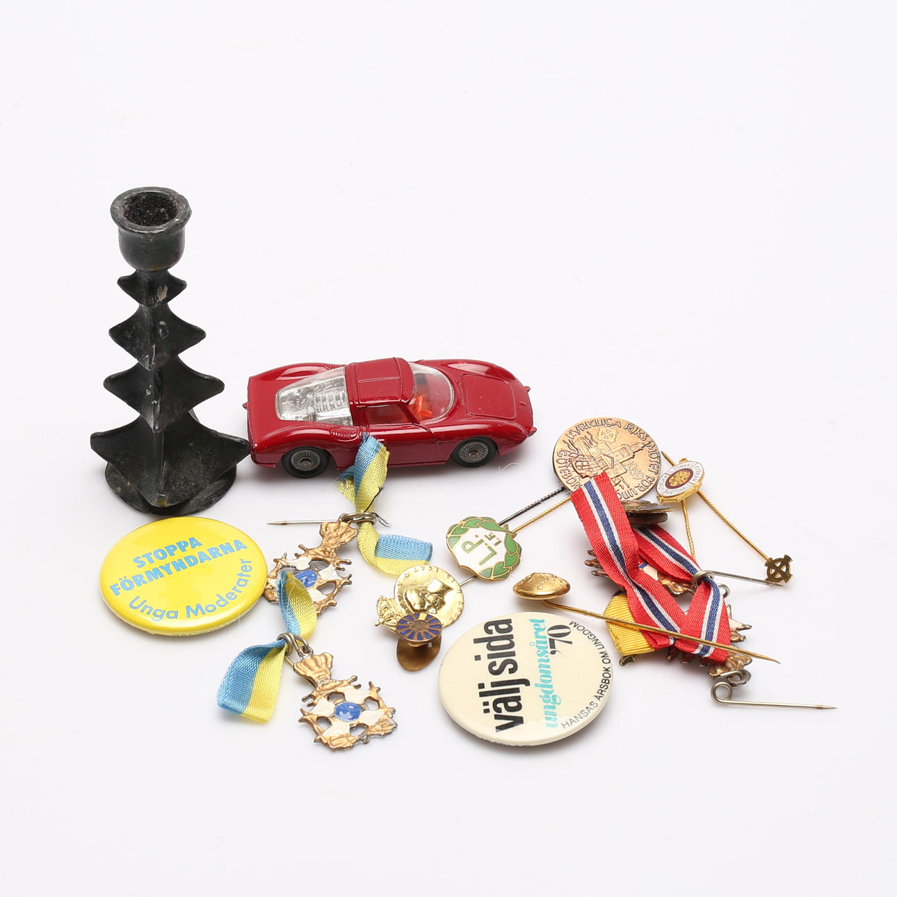 TOY CAR, PIN MARKS AND CANDLE STICK.