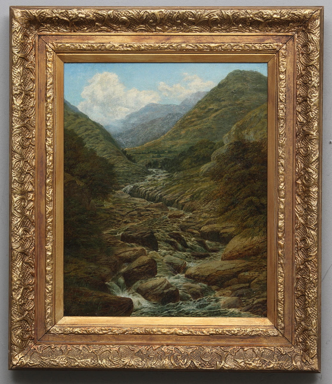 EDMUND M. GILL. Bergigt landskap med bäck. Olja på duk. Signerad E.Gill och daterad 1887.