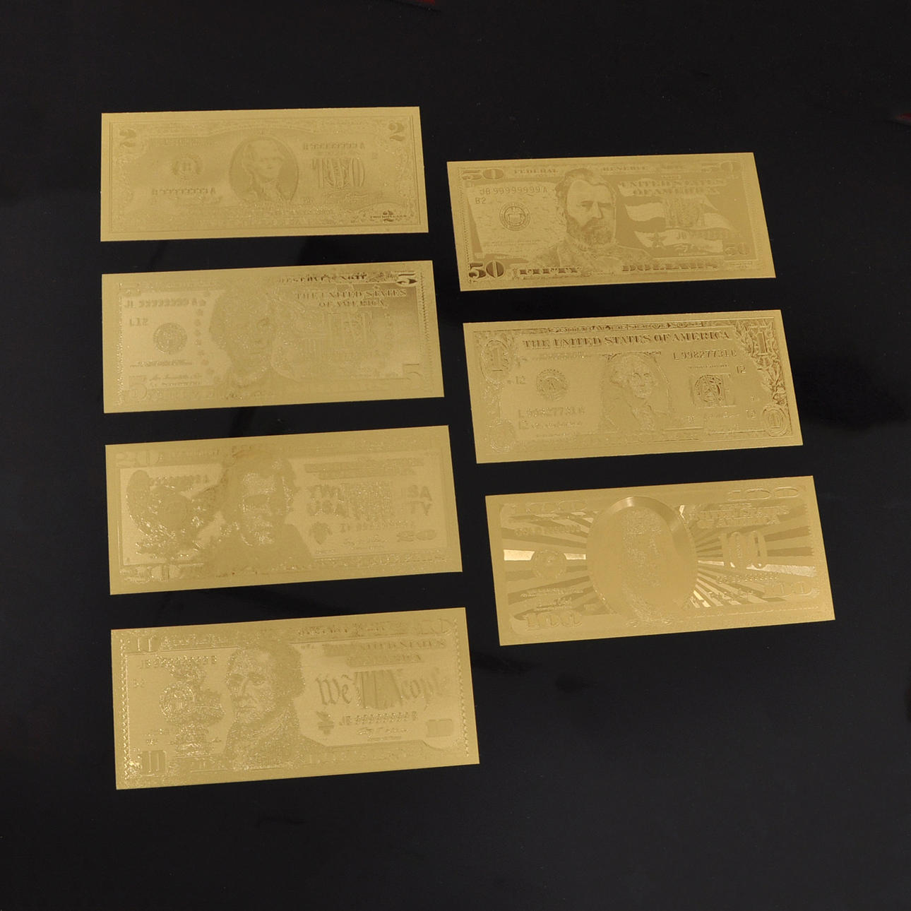 7 stk 24k guldbelagte amerikanske pengesedler.