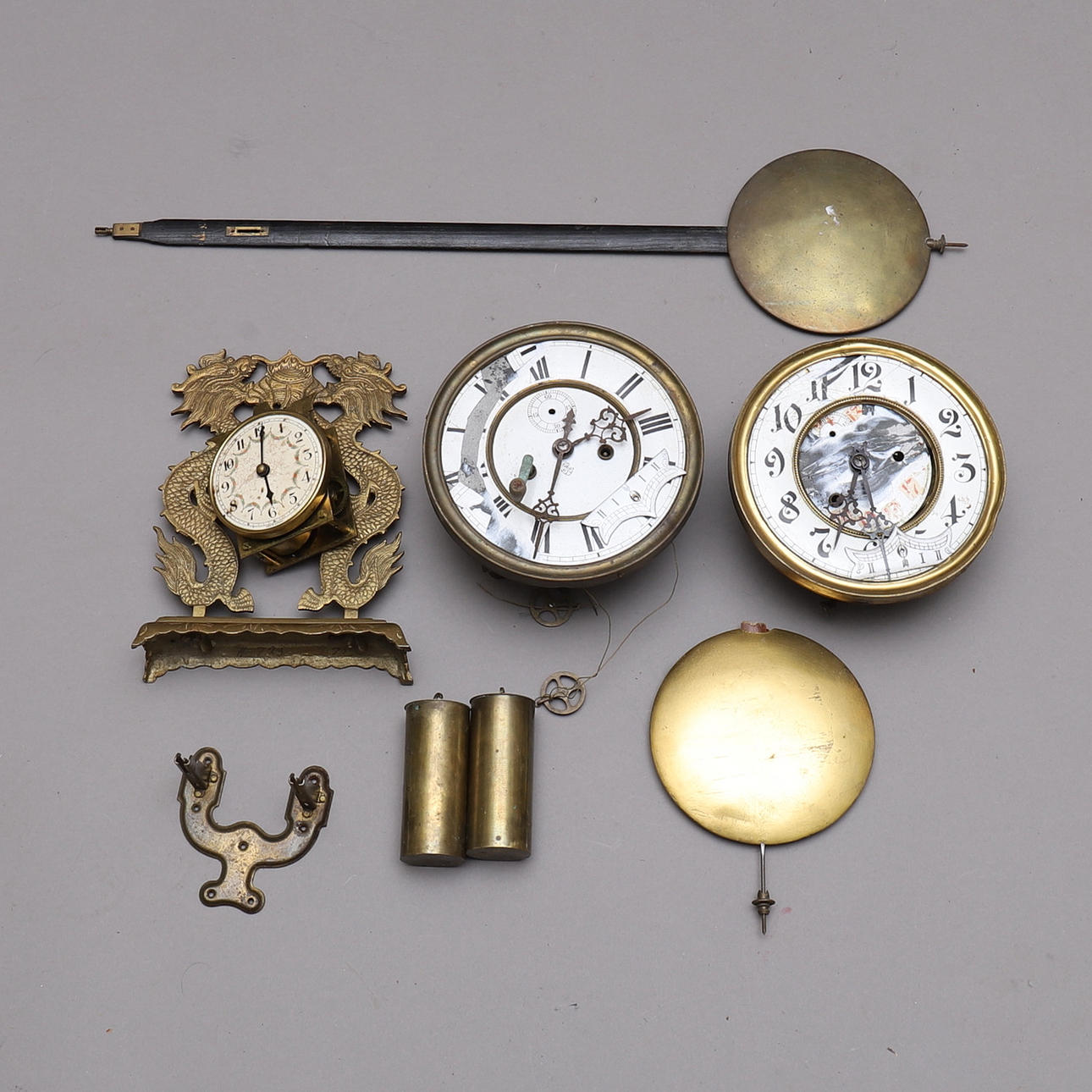 A Collection PARTS, i.a. pendulum & plumb bob.