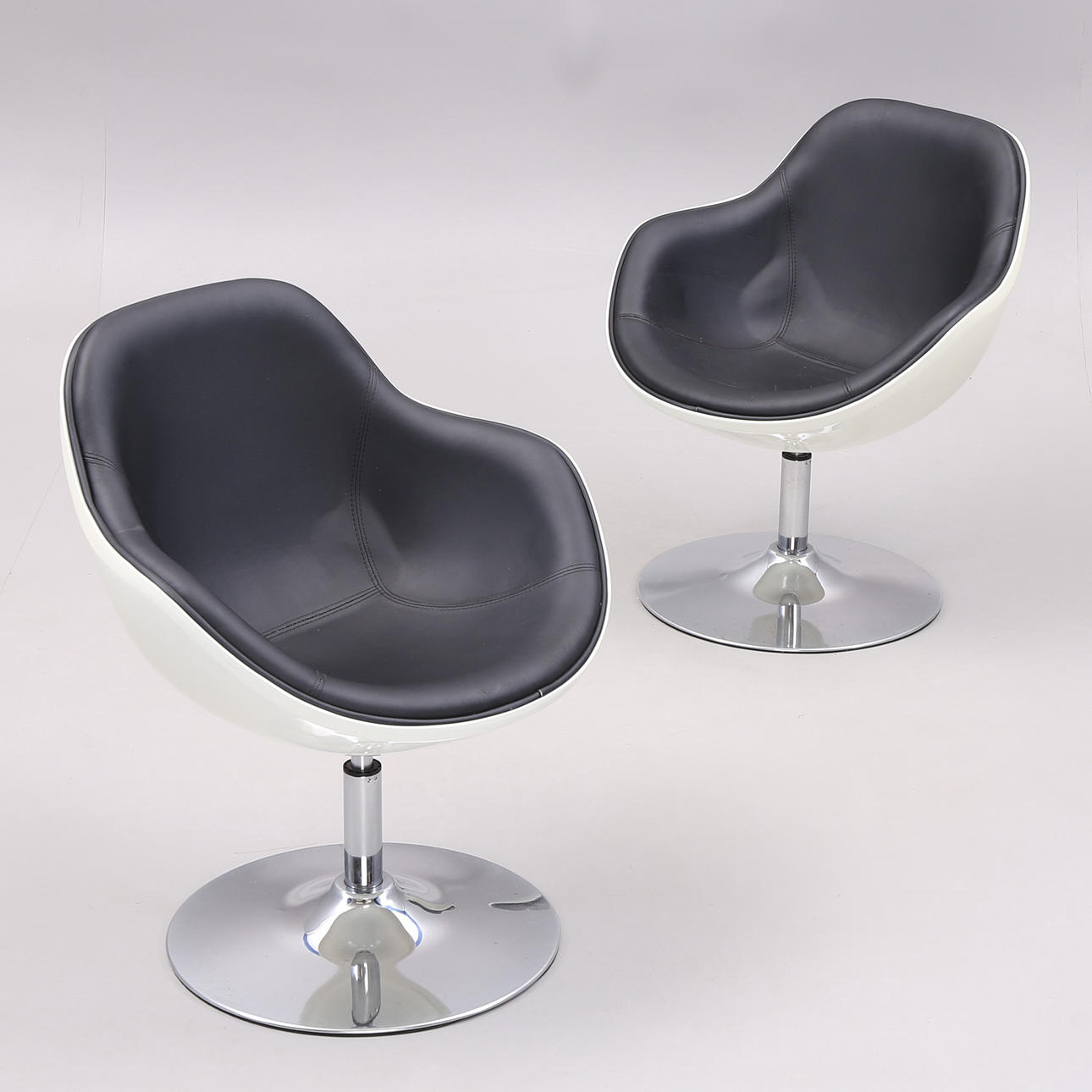 SPINNING ARMCHAIRS, chrome/plastic/artificial leather, 1900s/2000s.