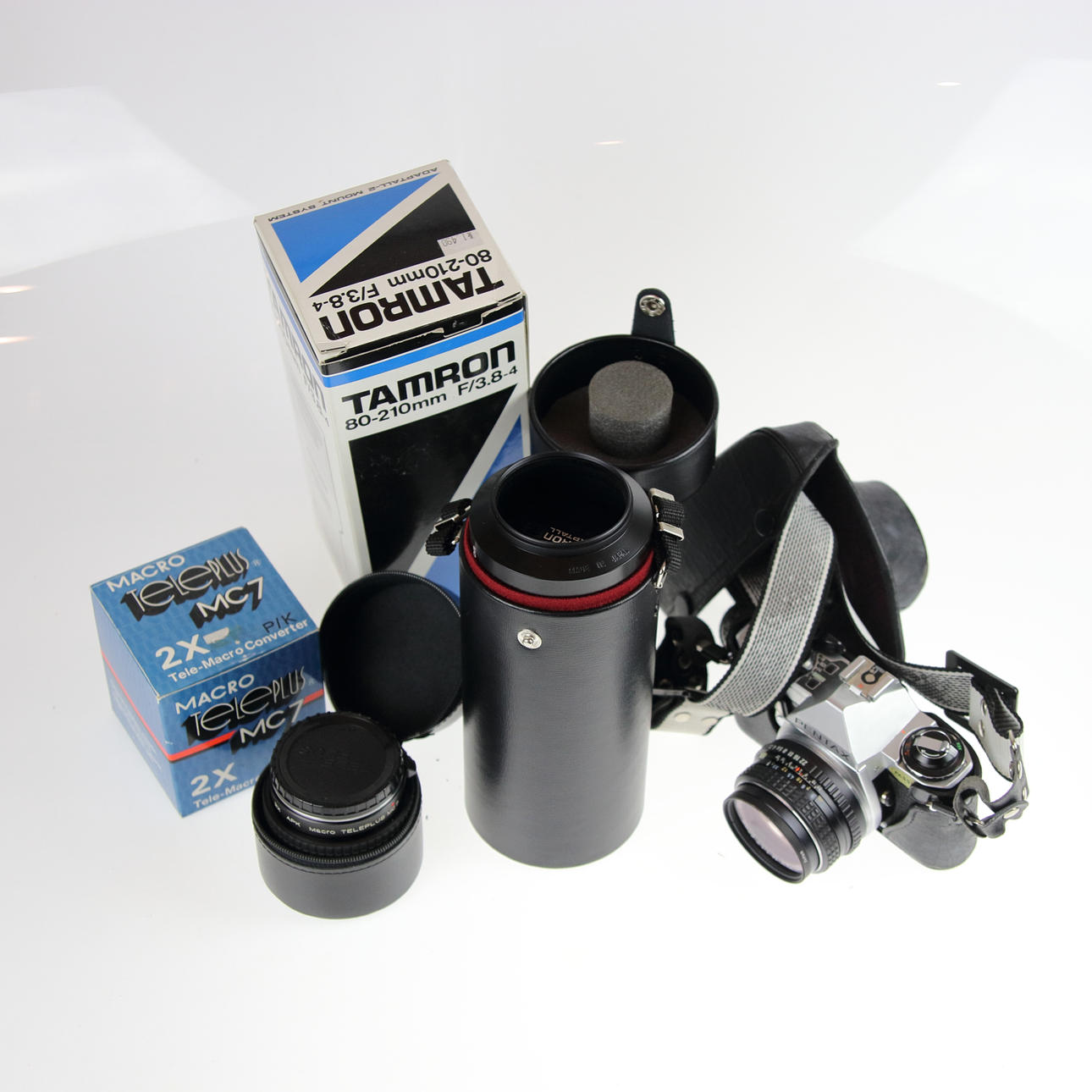 CAMARA Y LENTE, Pentax, Tamron, Teleplus.