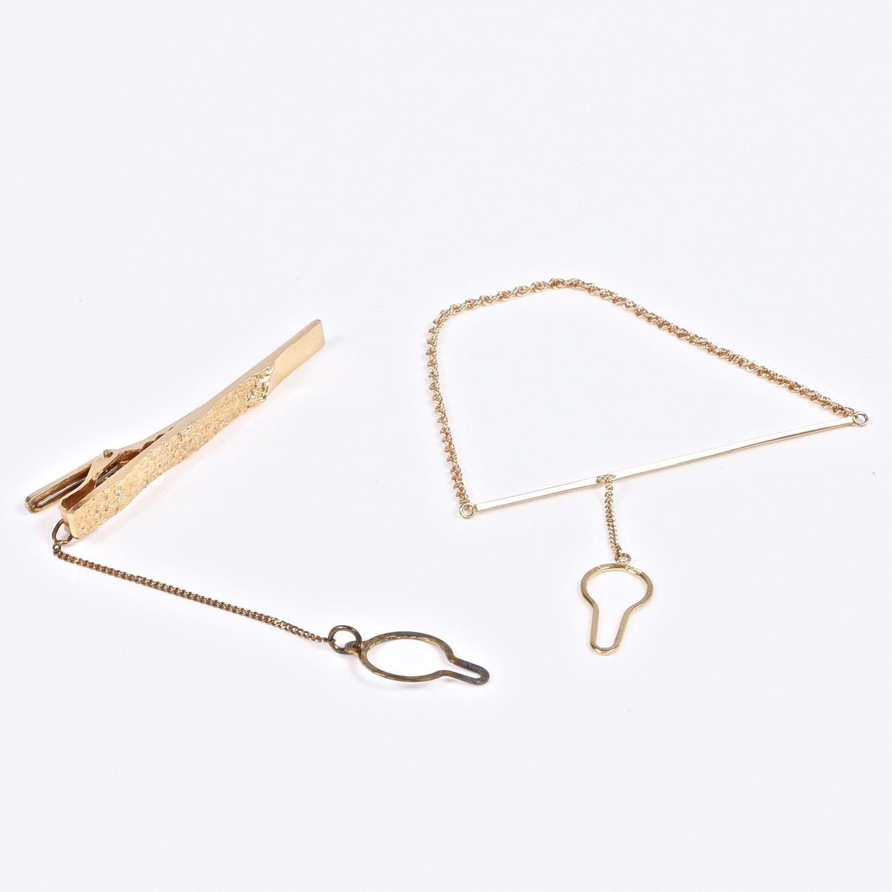 SLIPSNÅLAR, 2 st. 18k guld, delvis Sarek.