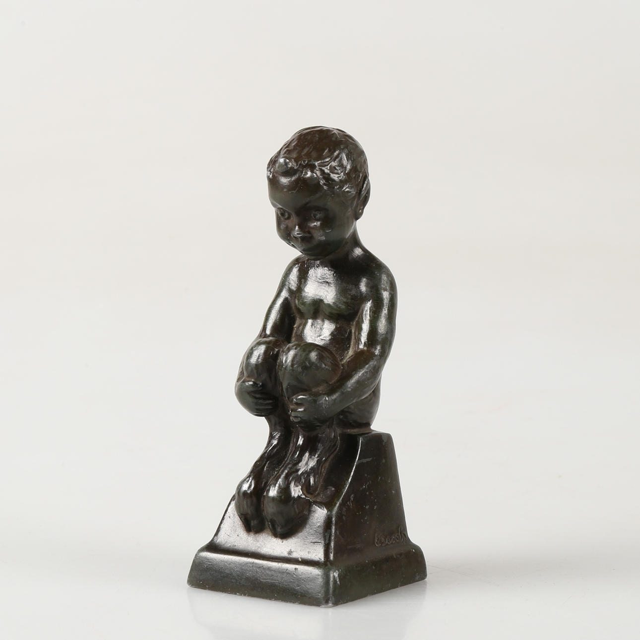 ELNA BORCH. Seated devil boy in patinated bronze, signed E Borch.