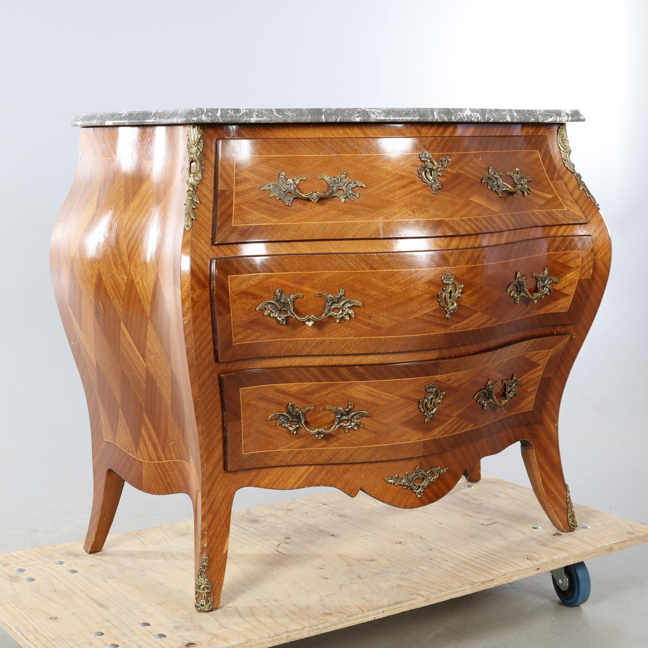 Chest of drawers, with stone top, rococo style.