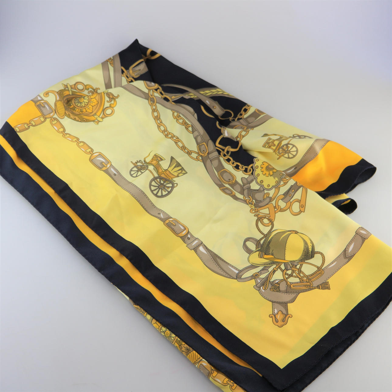 SILK SCARF WITH HERMES MOTIF.