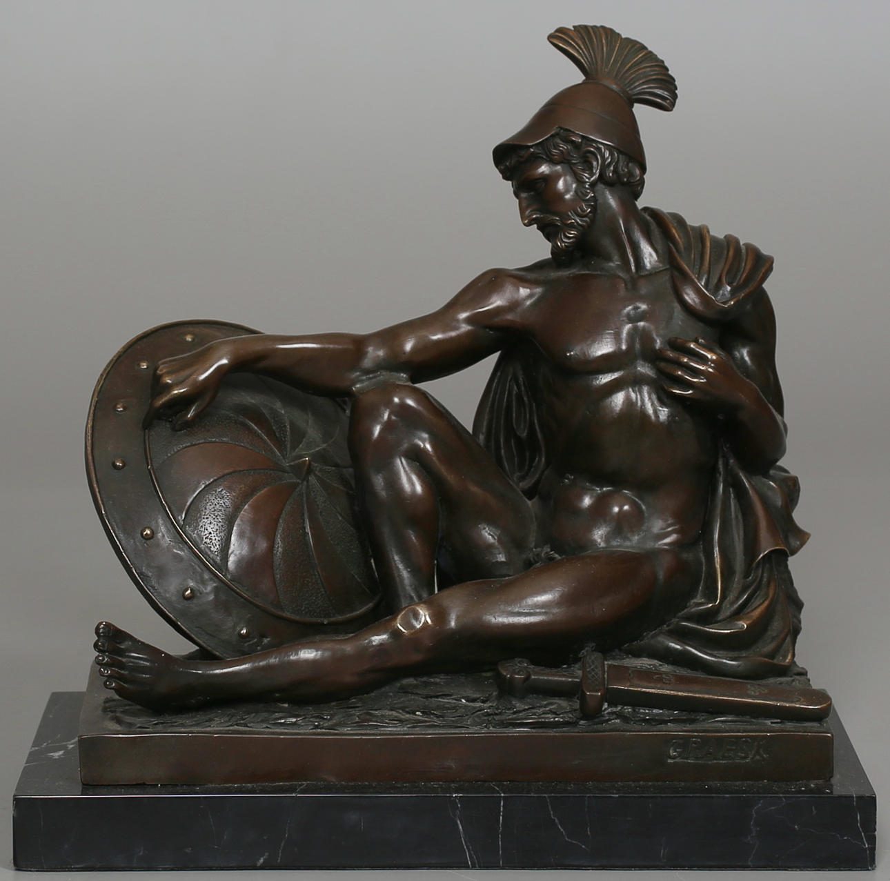 OKÄND KONSTNÄR. Sittande krigare " Graesk". Brons. Osignerad.