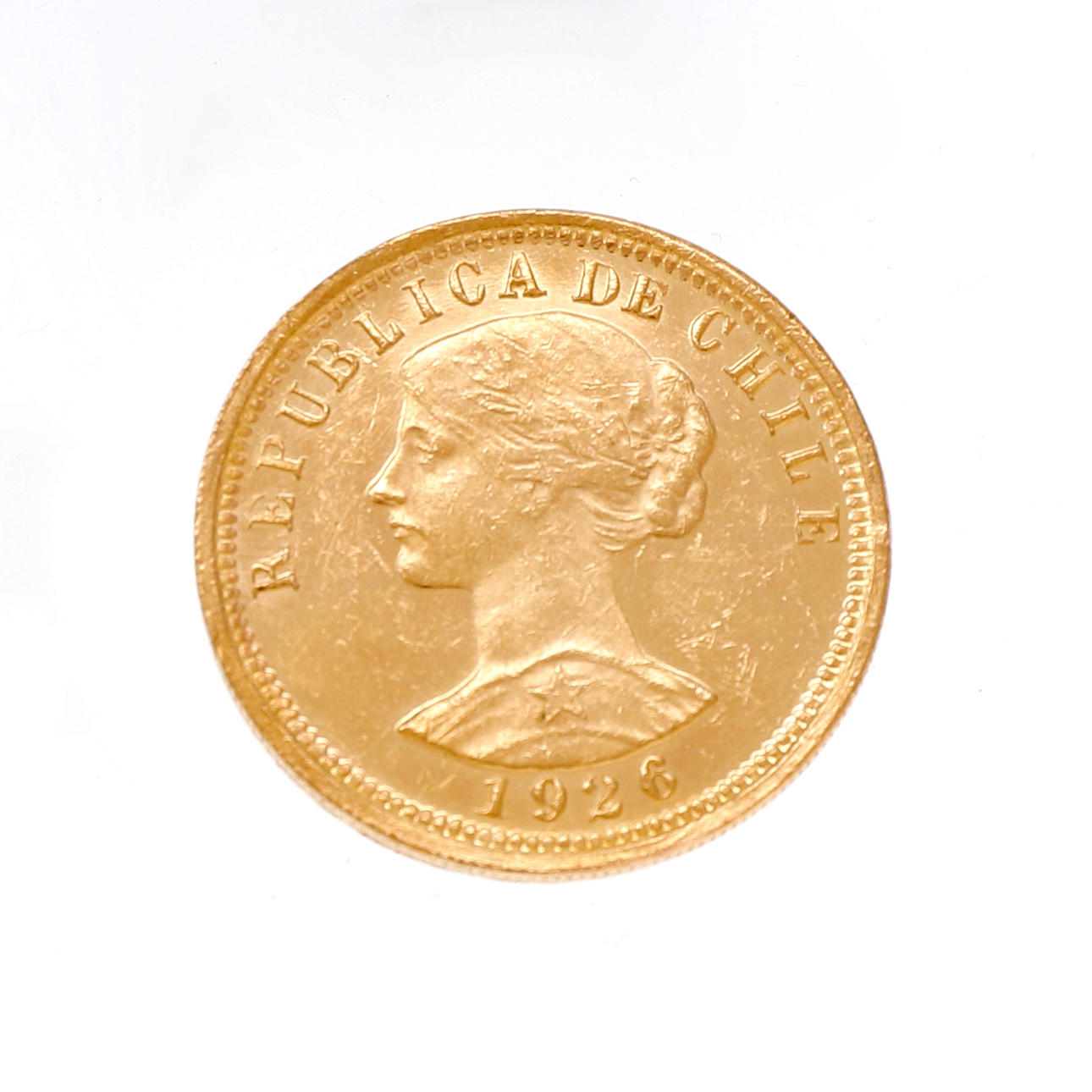 Moneda chilena en oro.