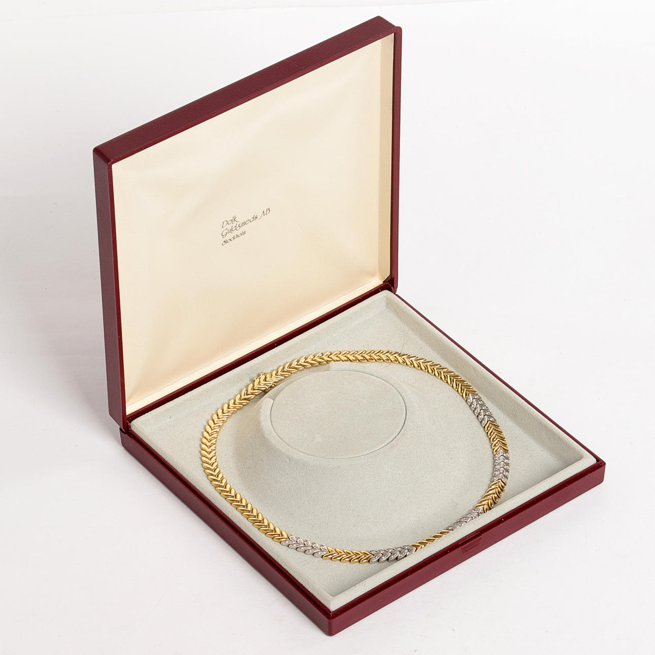 COLLIER, rött och vitt guld.