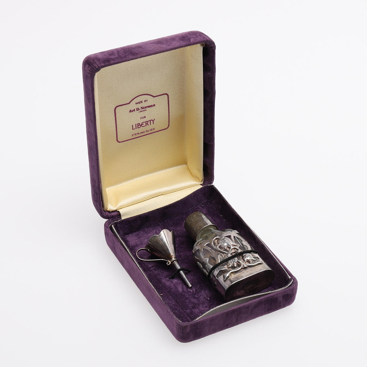 PERFUME BOTTLE WITH FUNNEL, ARI D. NORMAN FOR LIBERTY. Silver