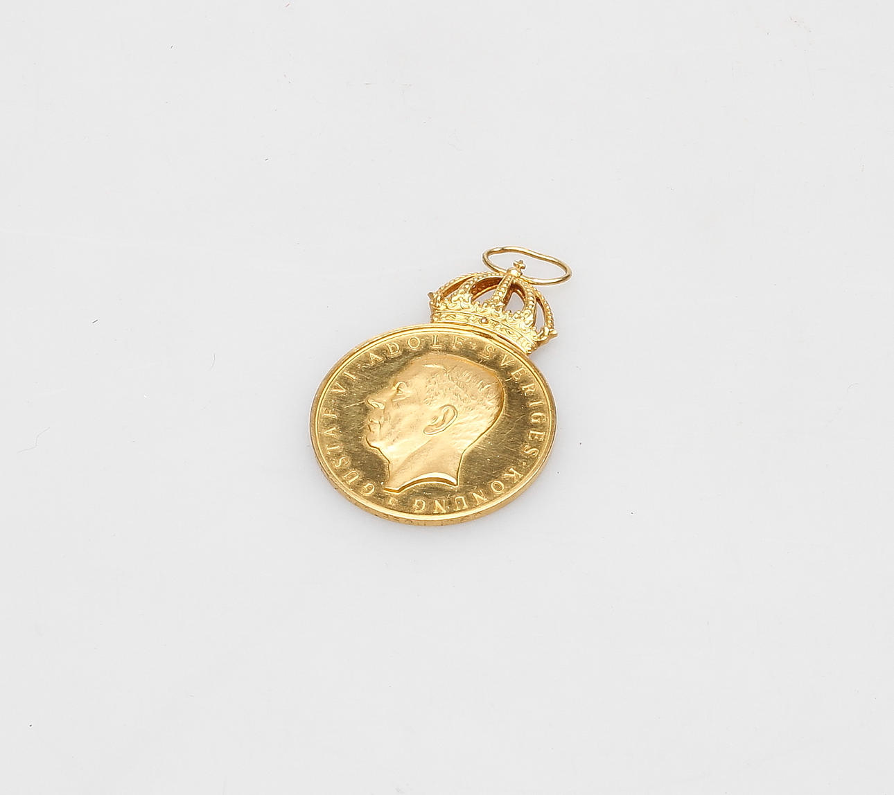 MEDALJ, guld 18k, vikt ca 19,1 gram.