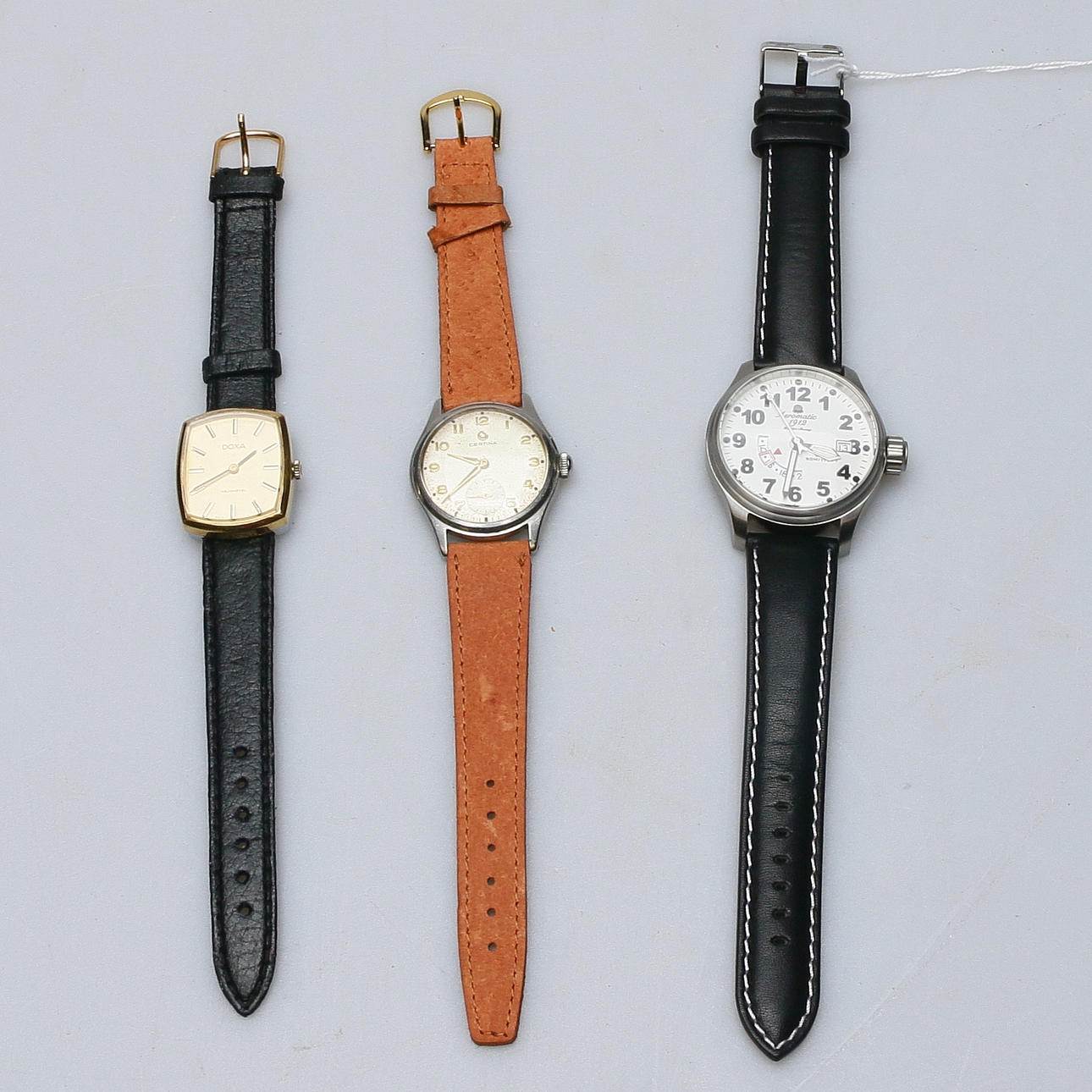 3 wristwatches, including Certina, Doxa.