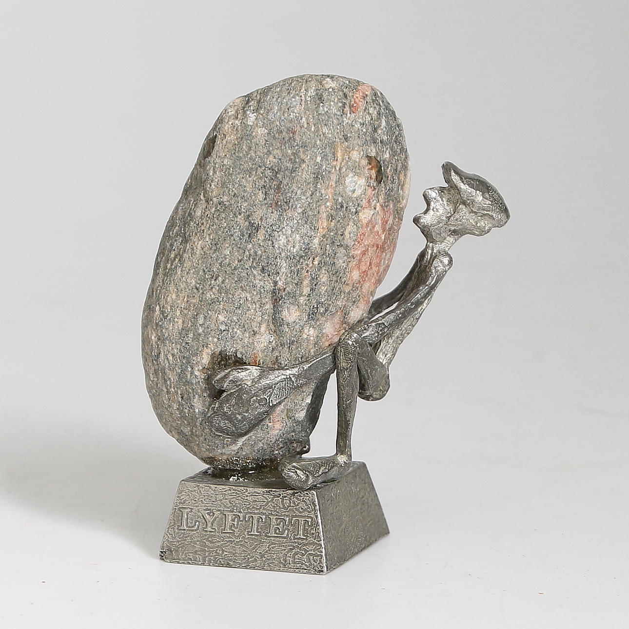 HENRY GUSTAFSSON, skulptur, sten och tenn, "Lyftet", signerad.