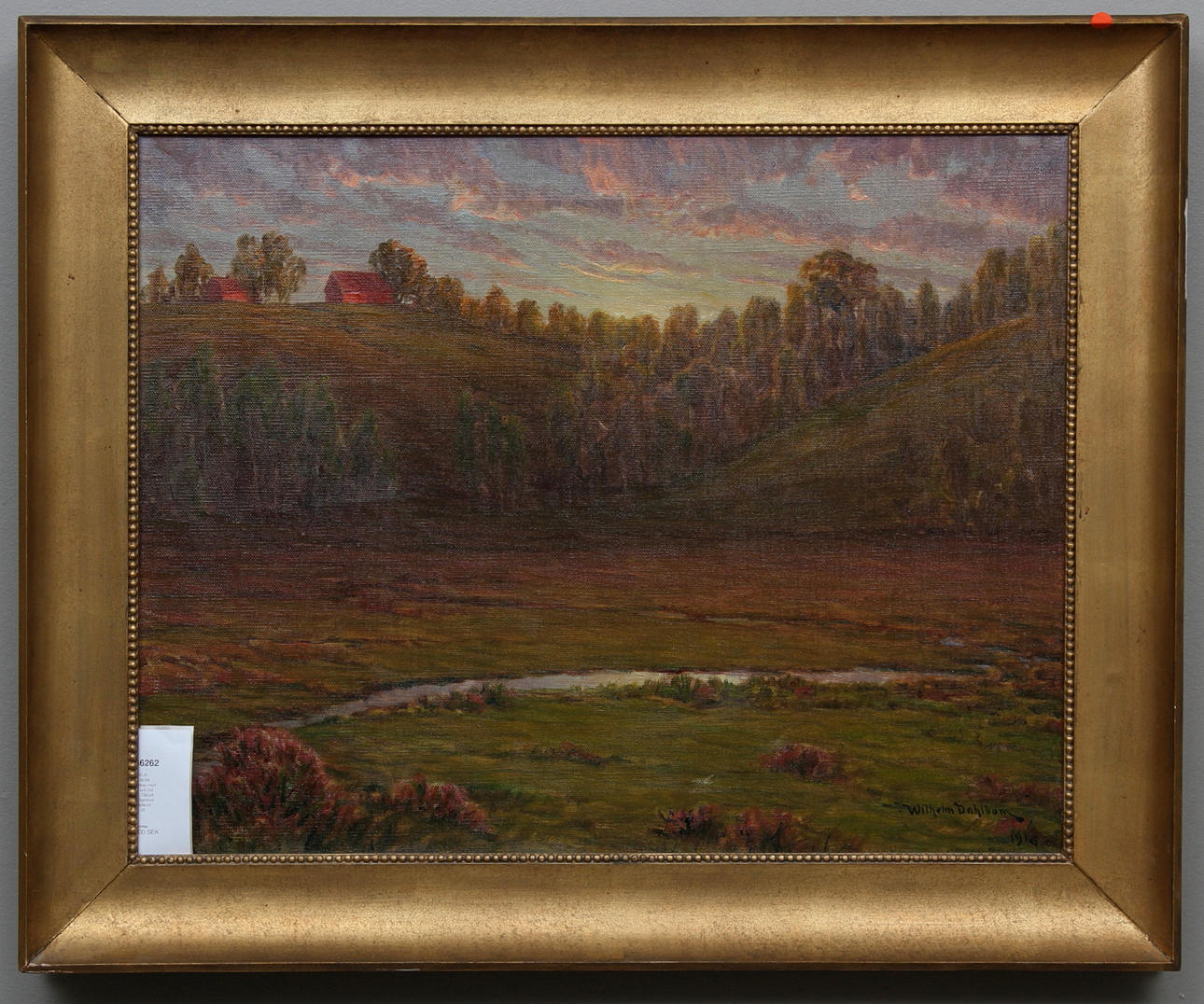 WILHELM DAHLBOM. Landskap med kullar och röd stuga. Olja på duk. Signerad och daterad 1916.