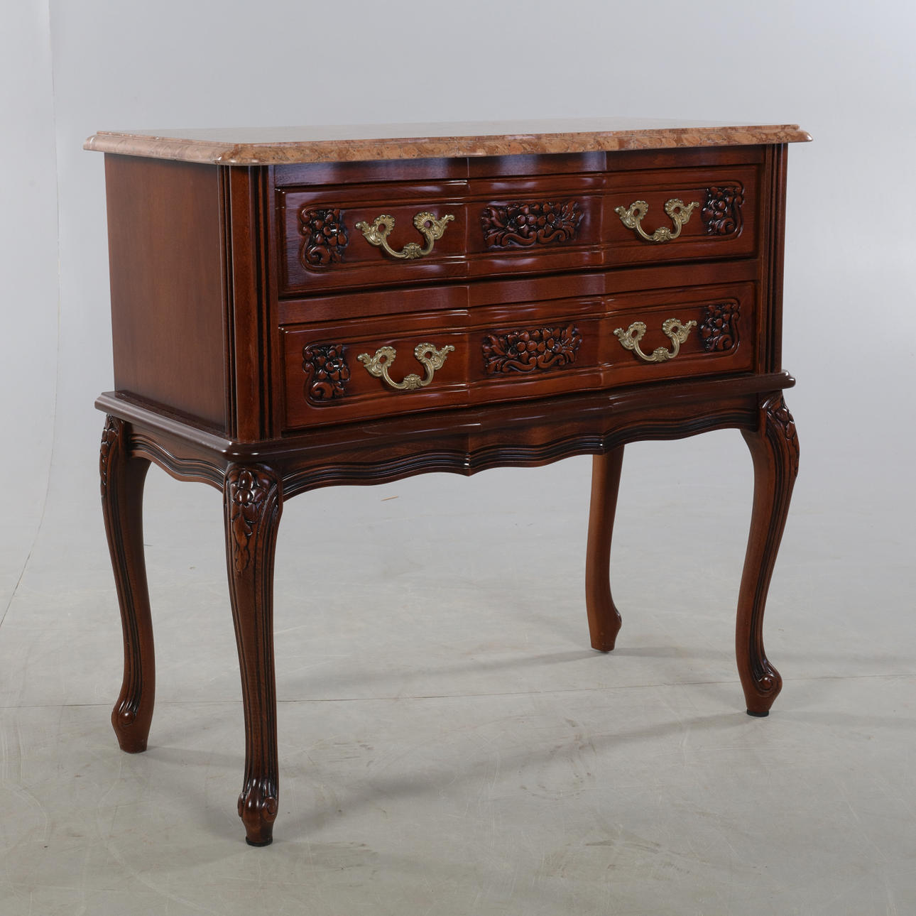 Chest of drawers with stone slab.
