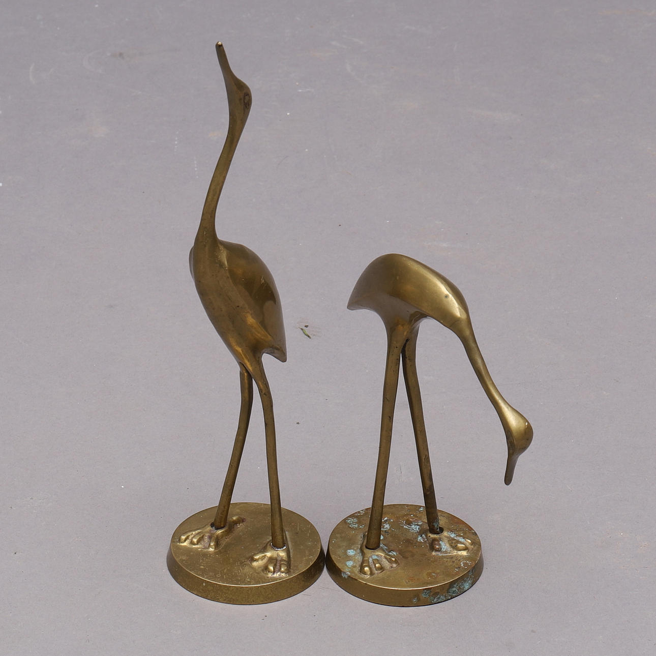 SCULPTURES, a pair, brass, Cranes.