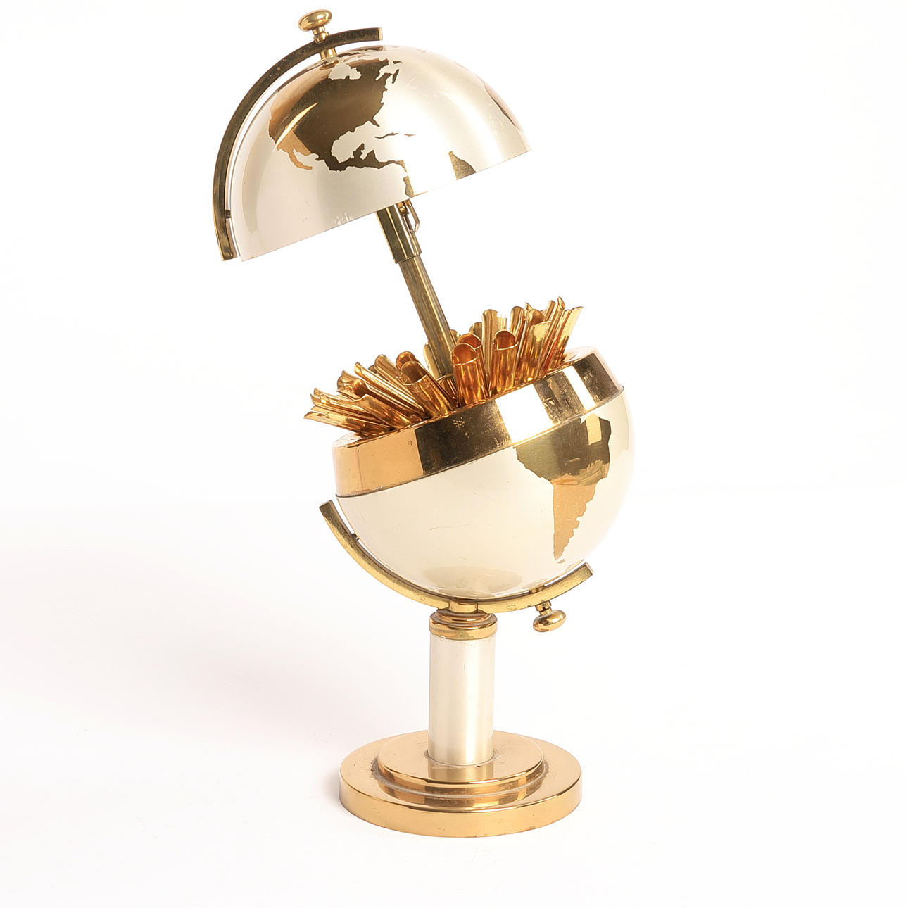 CIGARETTE HOLDER, in the shape of a globe, 1950s, aluminum and brass.  Silver & Metals - Other metals