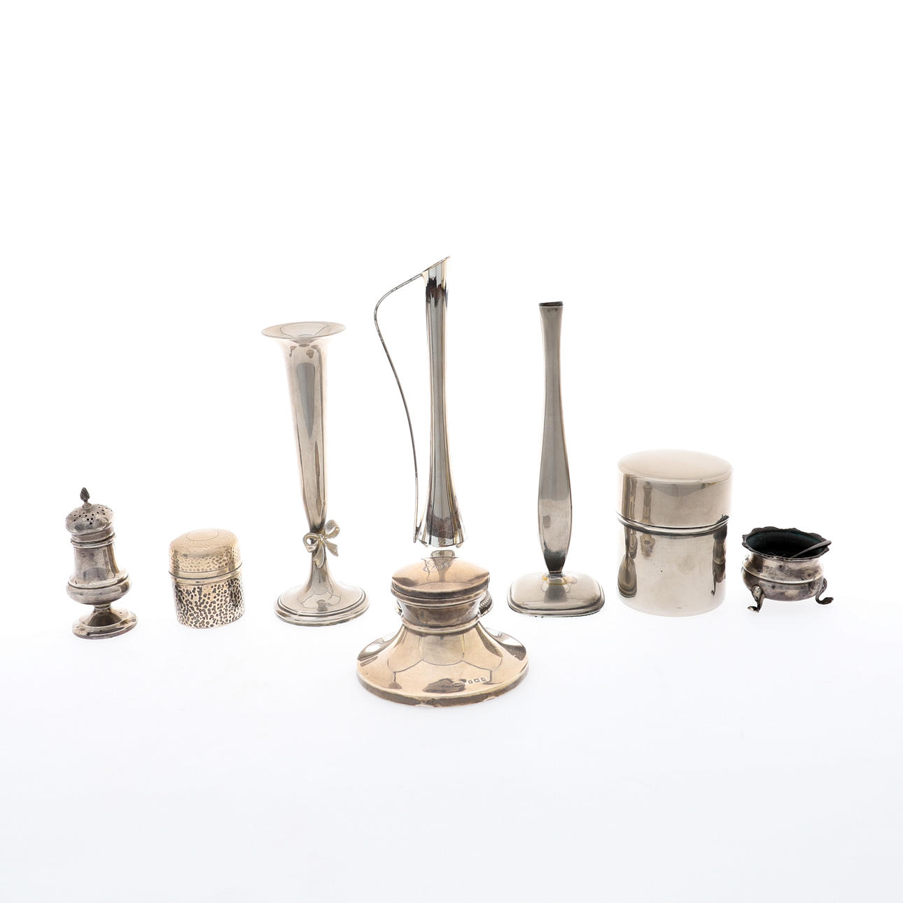 A SILVER CAPSTAN SHAPE INKWELL.