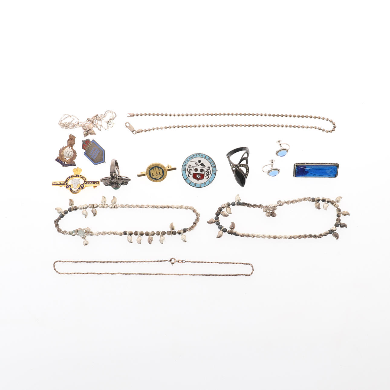 A SILVER DRESS RING.