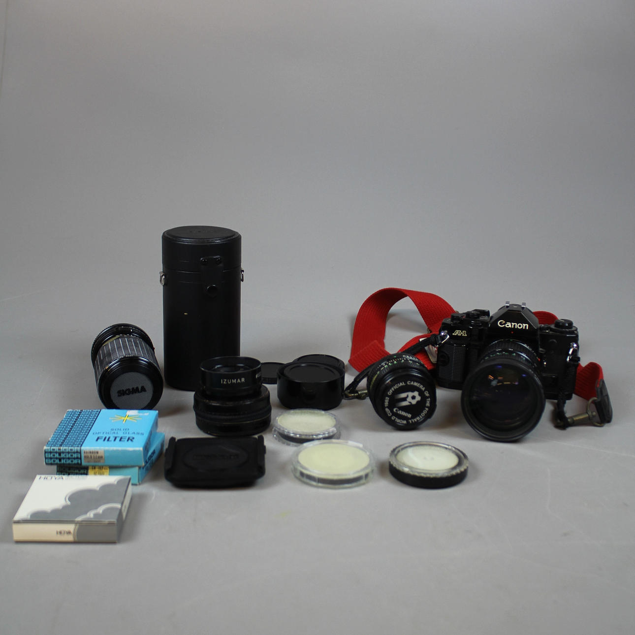 KAMERA Canon A-1 med 3 objektiv.