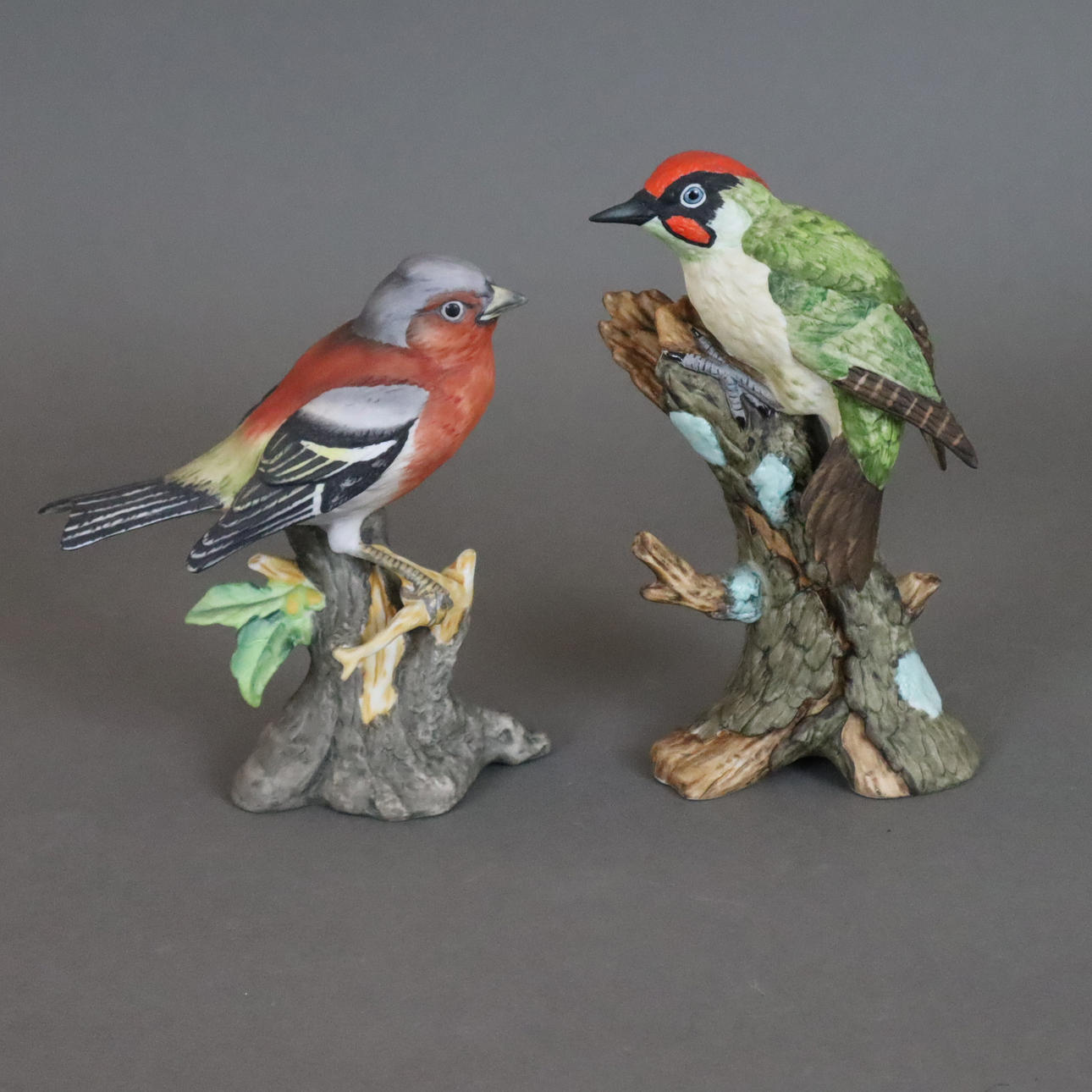 --2 BIRD FIGURES, bisque porcelain, polychrome painted.