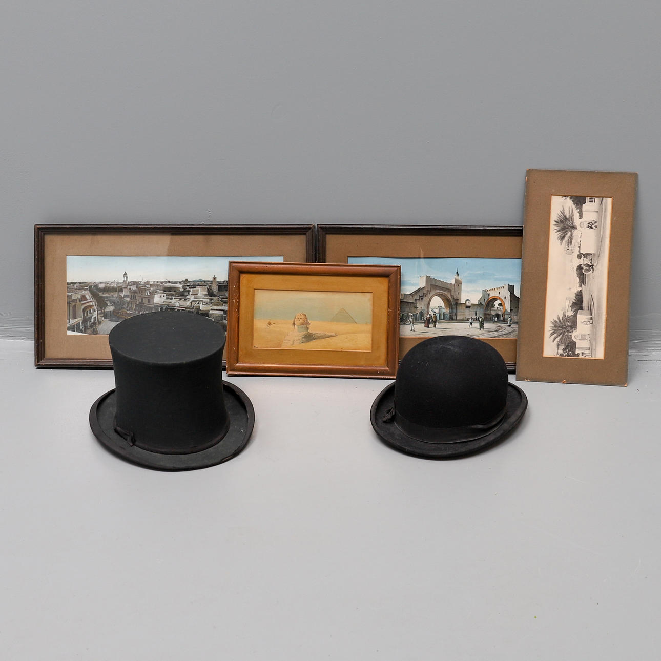 A FOLDING BLACK SILK OPERA HAT.