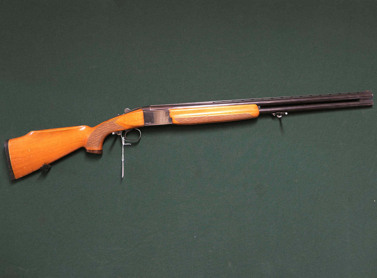 TIKKA. model M77, caliber 12, serial number 14045.