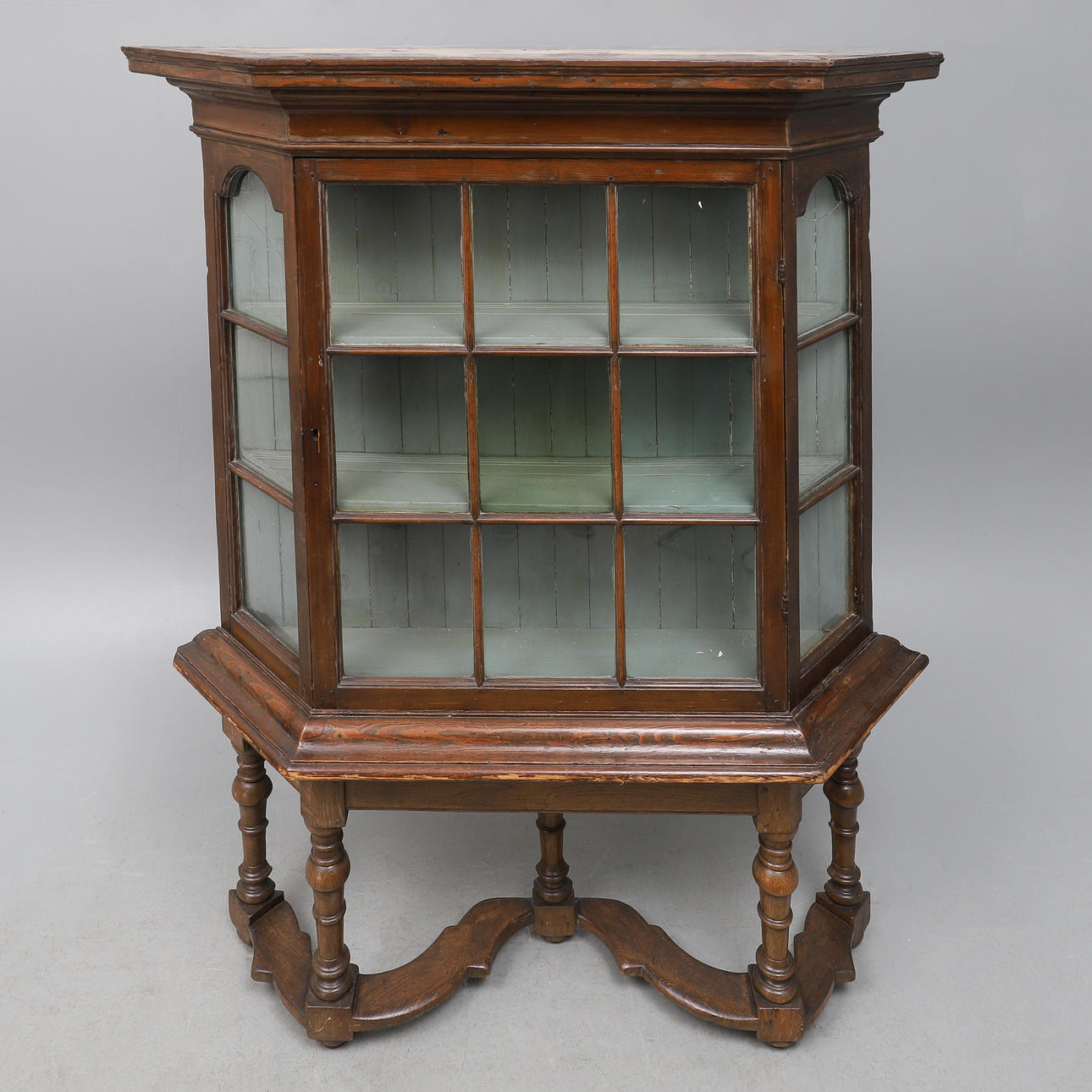 A DUTCH STAINED PINE WEDGE SHAPE CHINA CABINET.