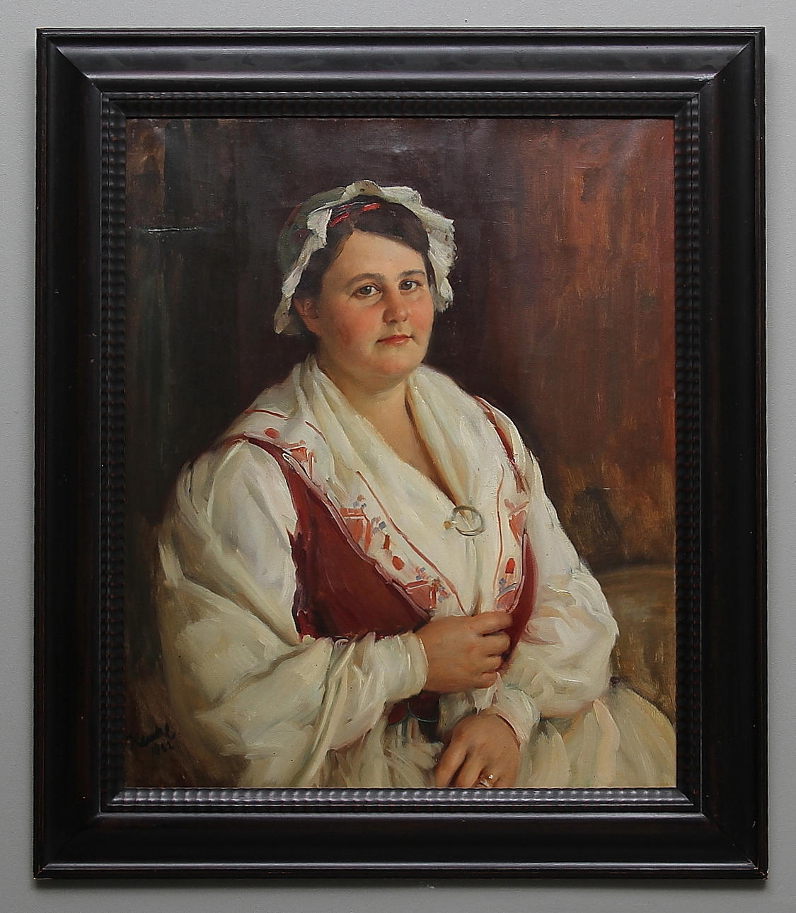 IVAR KAMKE. Porträtt av Hanna Hultner iförd östgötadräkt. Olja på duk. Signerad och daterad 1932.