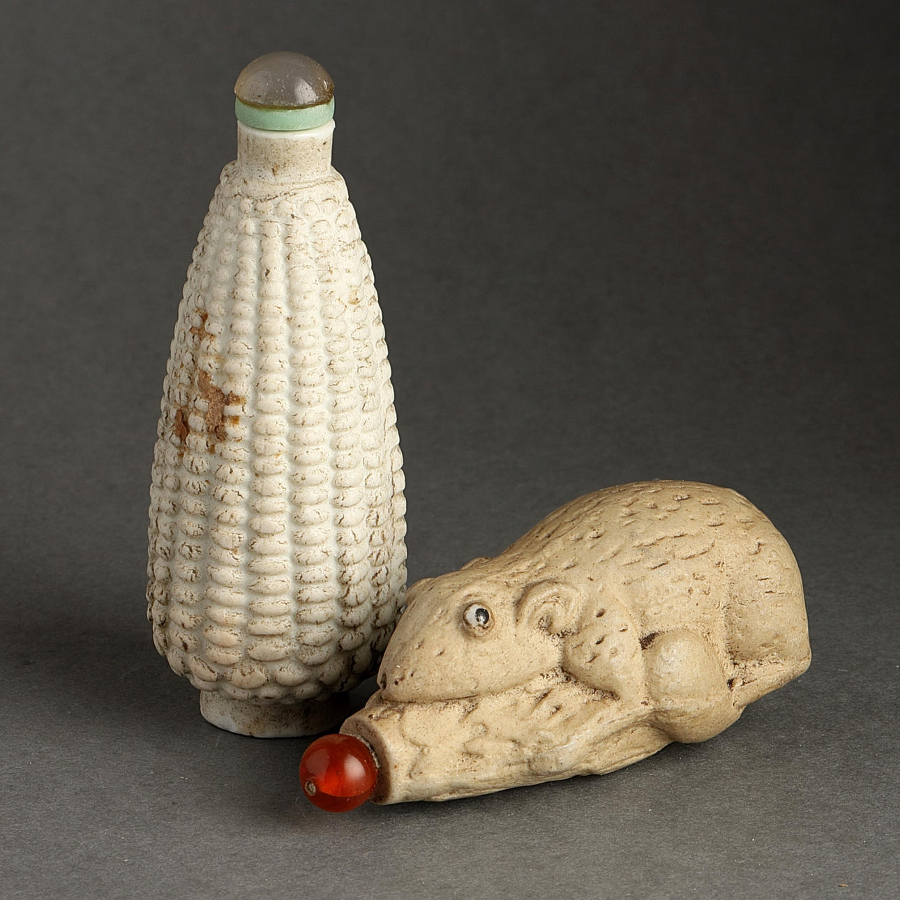 SNUFF BOTTLES, 2 pcs., probably earthenware, China, 18/1900s.