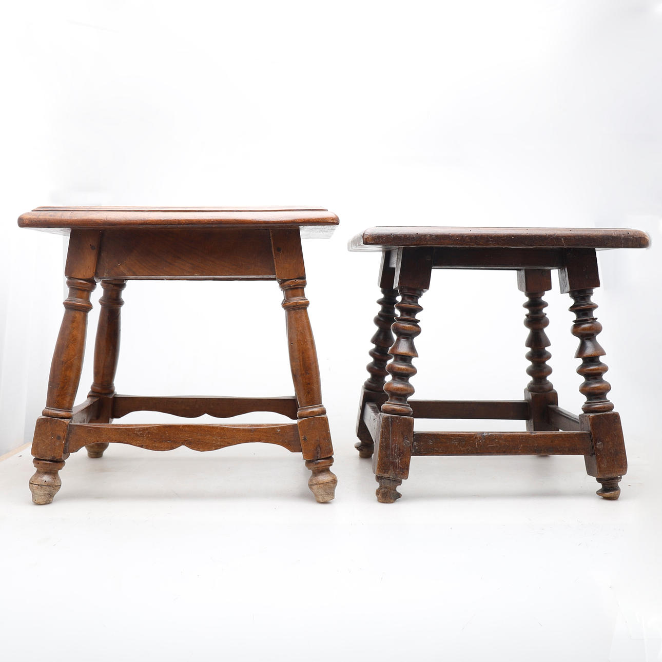 Two Spanish walnut stools, 18th Century.