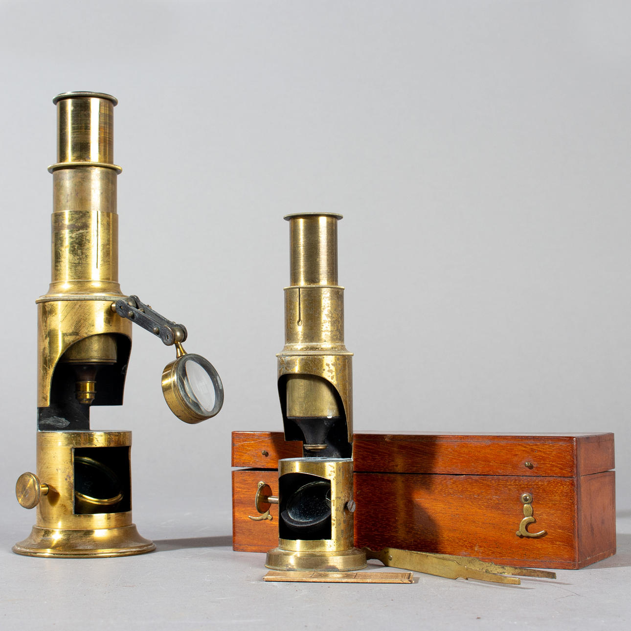 Two field microscopes, brass, 19th century (2).