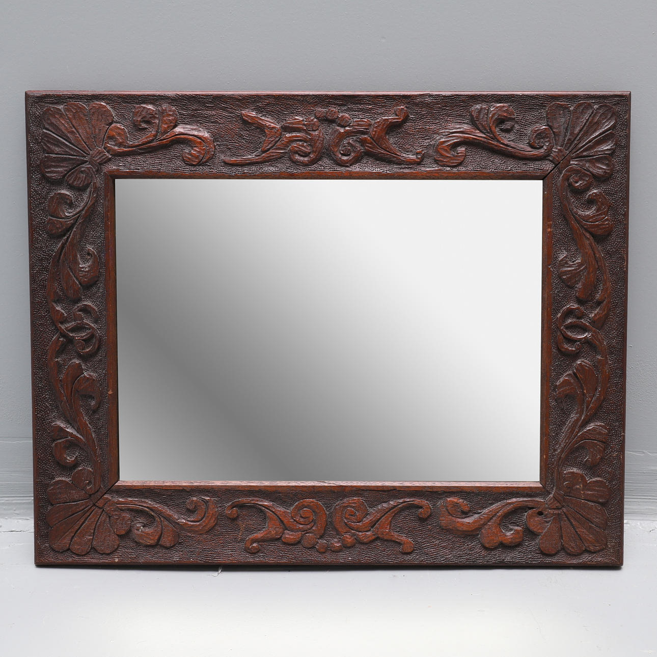 A LATE 19TH CENTURY RECTANGULAR MAHOGANY FRAME BEVEL EDGE WALL MIRROR.