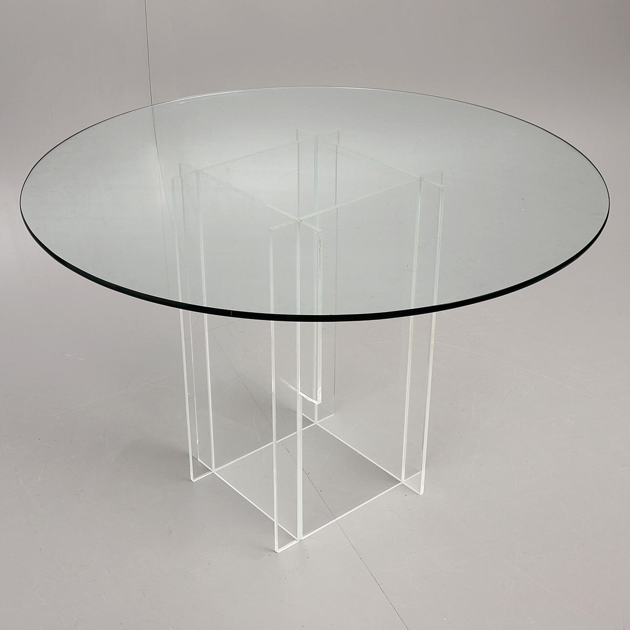 DINING TABLE, 2000s, base in plexiglass, top in glass.