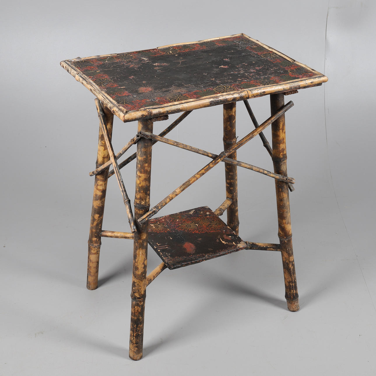 AN EDWARDIAN BAMBOO TWO-TIER OCCASIONAL TABLE.