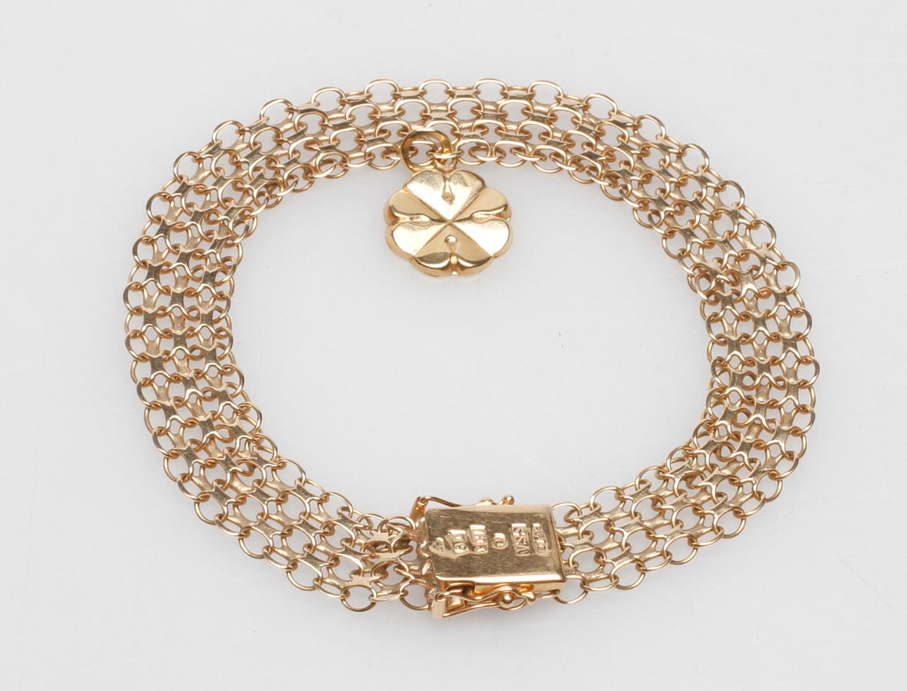 ARMBAND X-LÄNK MED EN BERLOCK, 18k guld, vikt ca 11,2 gr.