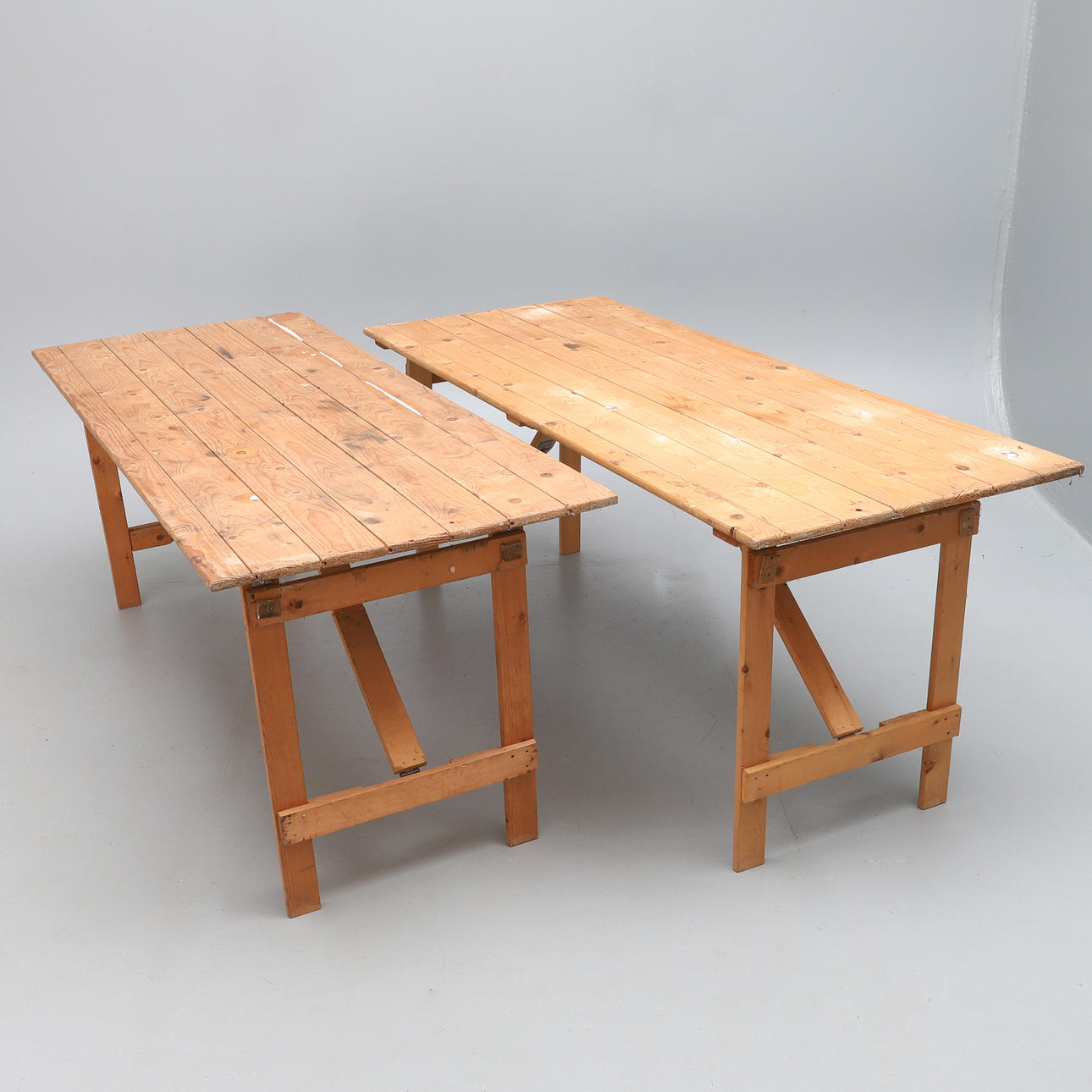 A PAIR OF PINE TRESTLE TABLES.