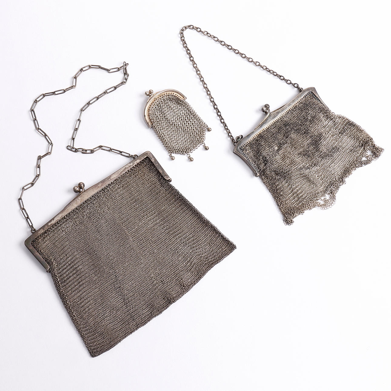 AFTONVÄSKOR, 2 st., MYNTPÅSE, silver, 1900-tal.