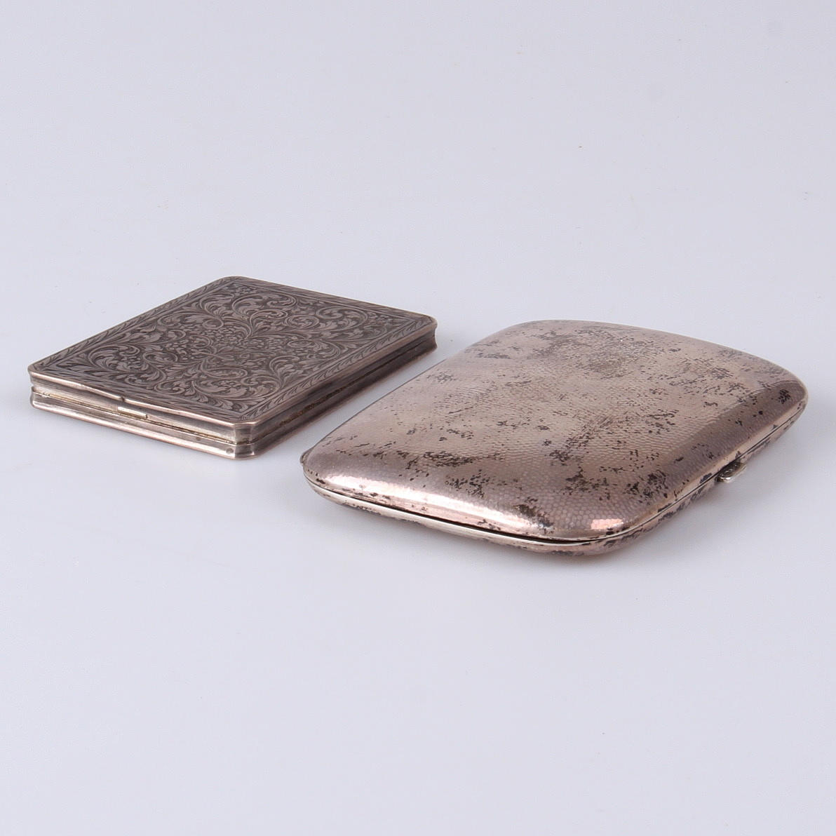 CIGARETTETUIER, 2 st, varav ena CG Hallberg, 1924.