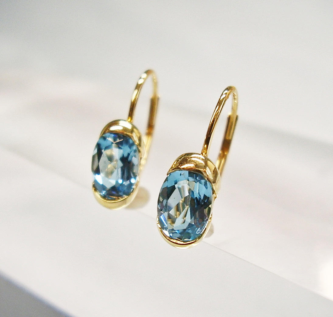 ARETES TOPACIO AZUL ORO AMARILLO 14K.