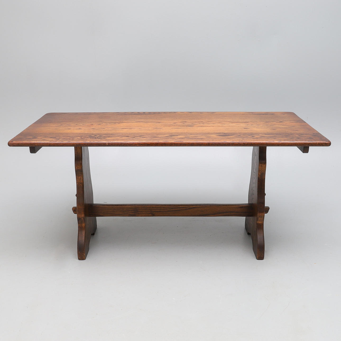 A REPRODUCTION OAK REFECTORY TABLE.