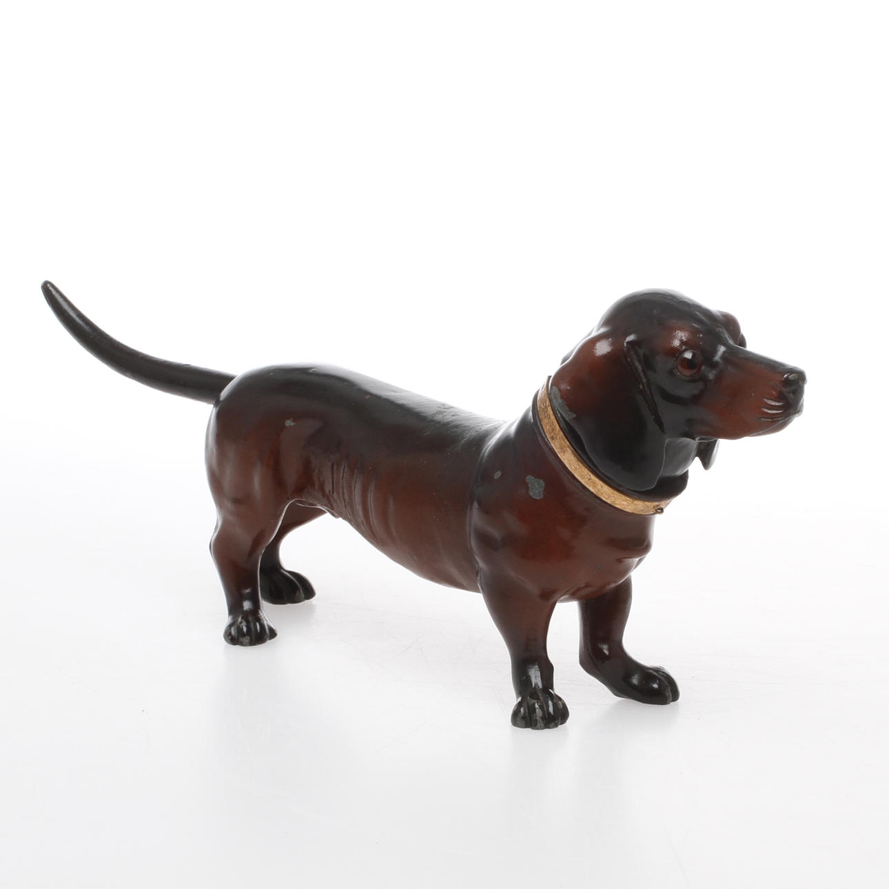 BORDSTÄNDARE i form av tax, metall, 1900-talets första hälft.