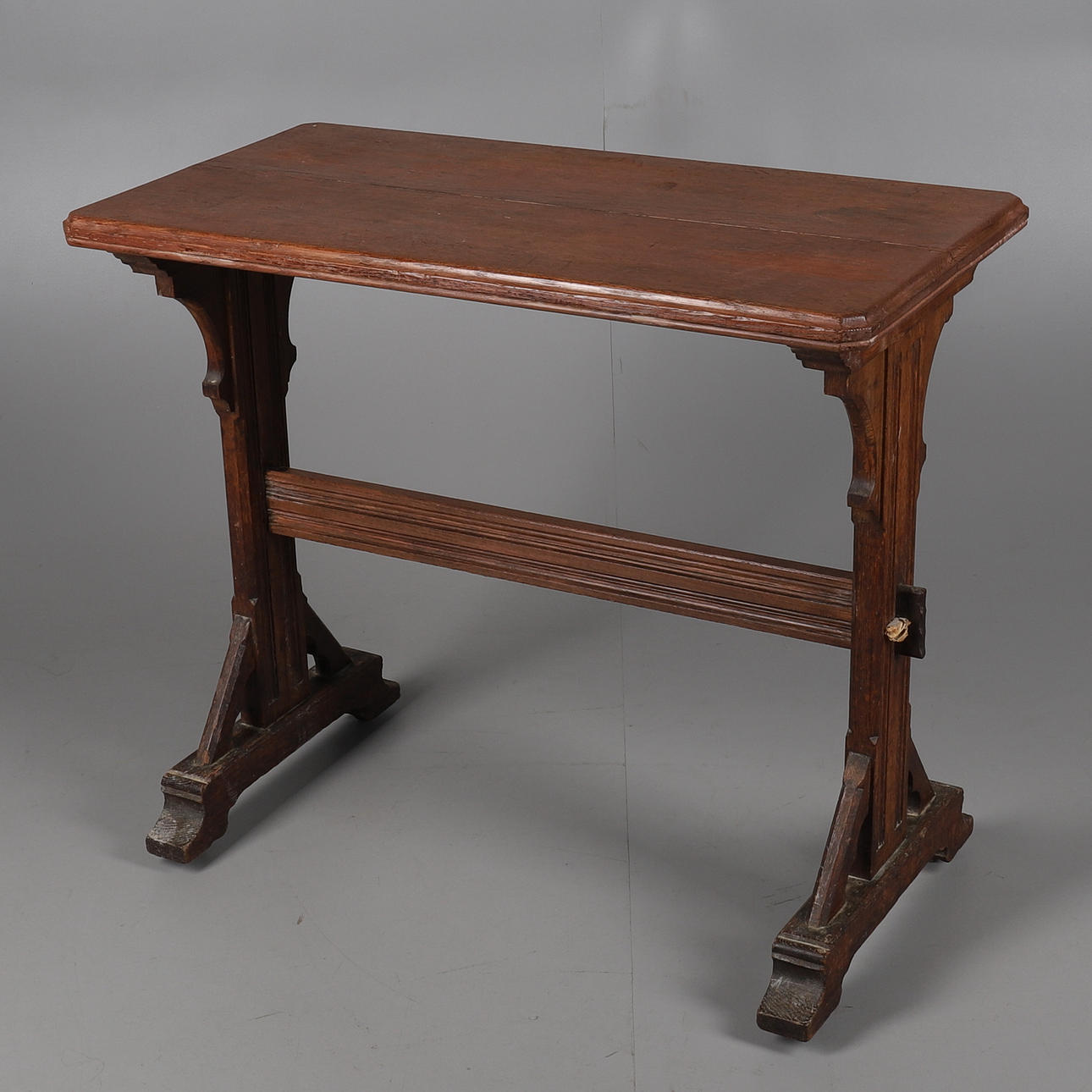 A VICTORIAN GOTHIC REVIVAL LIGHT OAK HALL TABLE.