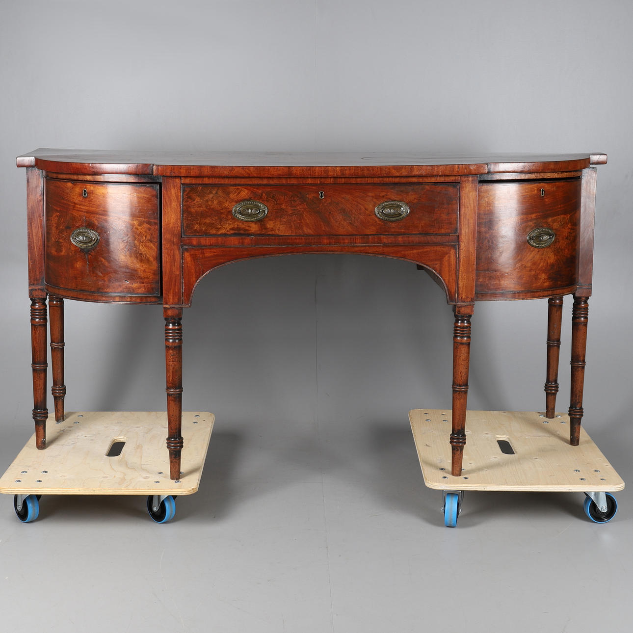 A GEORGE IV MAHOGANY BOWFRONT SIDEBOARD.