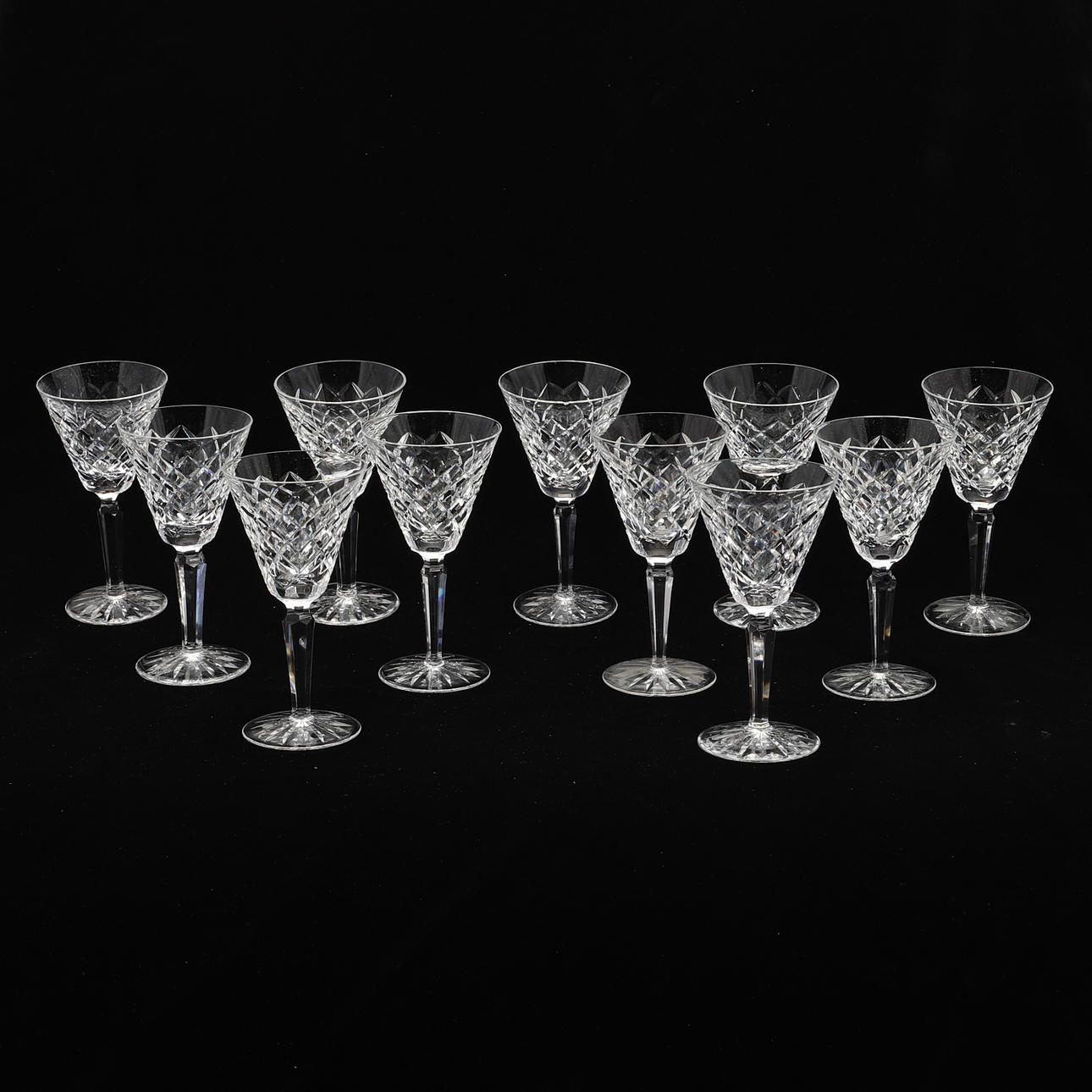 ELEVEN WATERFORD CRYSTAL TYRONE PATTERN WINE GLASSES.