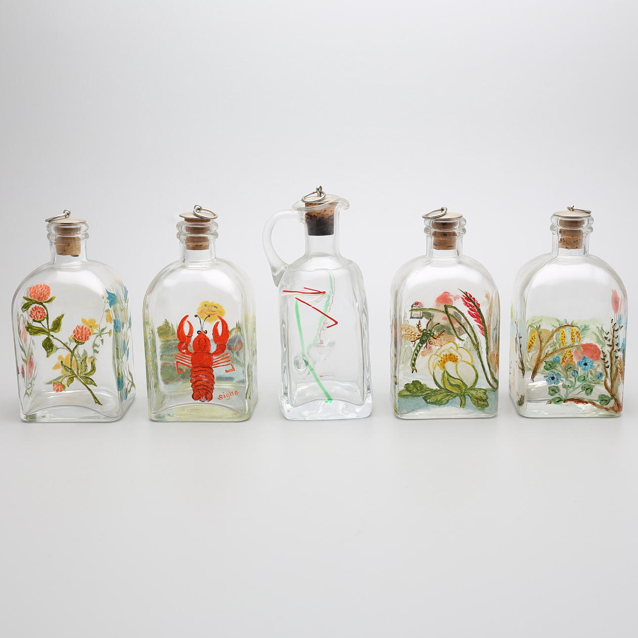 BRÄNNVINSFLASKOR (5), Snapphane glasbruk och Glashyttan Ulven, 1900-talets andra hälft.