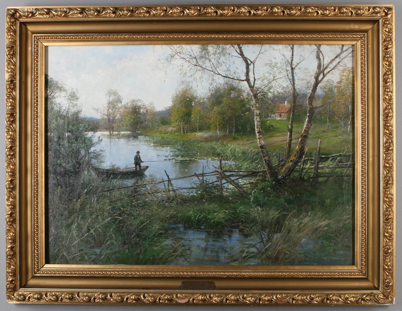 SEVERIN NILSON. Insjölandskap med fiskande man, olja på duk, signerad.