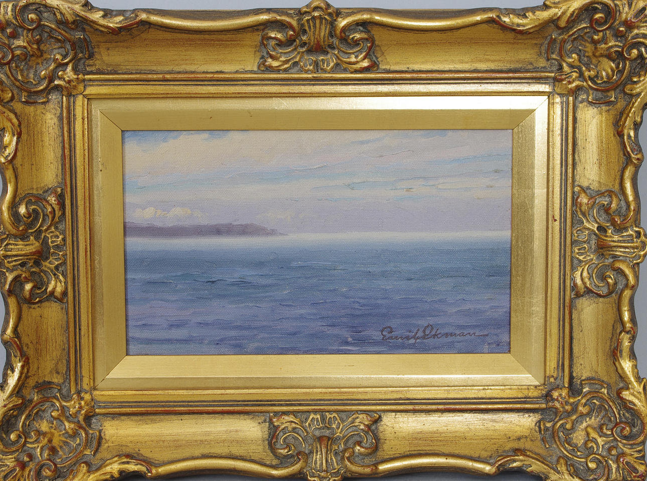 EMIL GOTTHARD EKMAN. Kustparti, duk uppklistrad på pannå, signerad Emil Ekman.