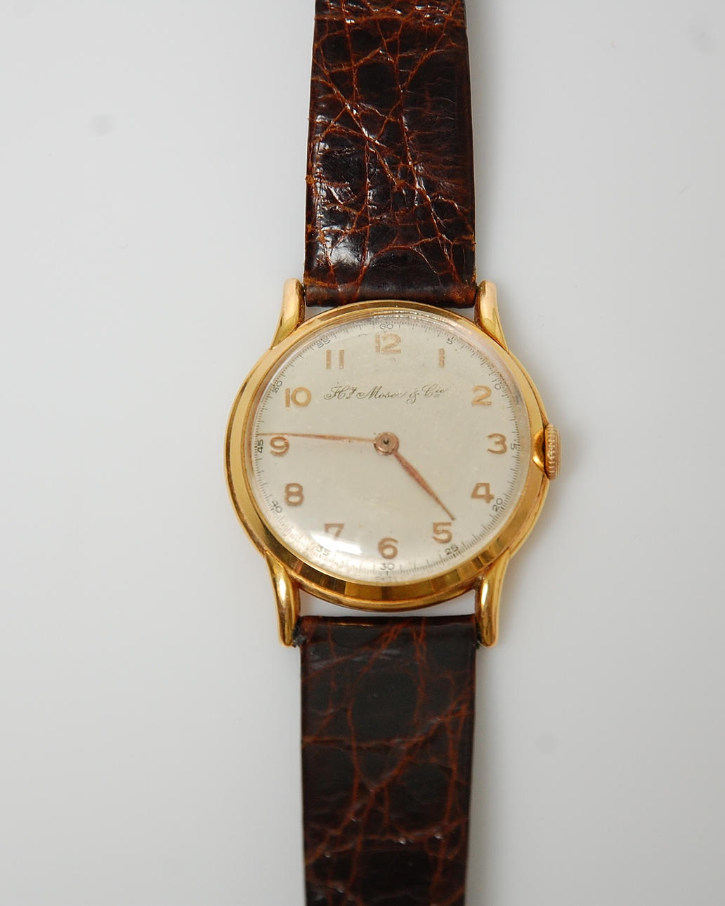 HERRARMBANDSUR, H Moser & Cie,18 K guld.