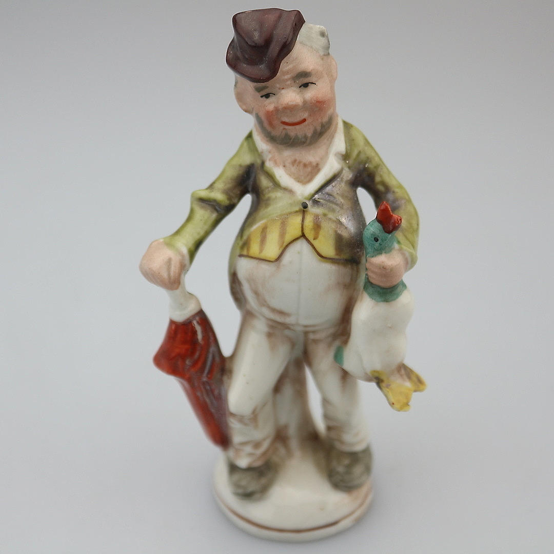 ANTIKE PORZELLANFIGUR MANN MIT ENTE.